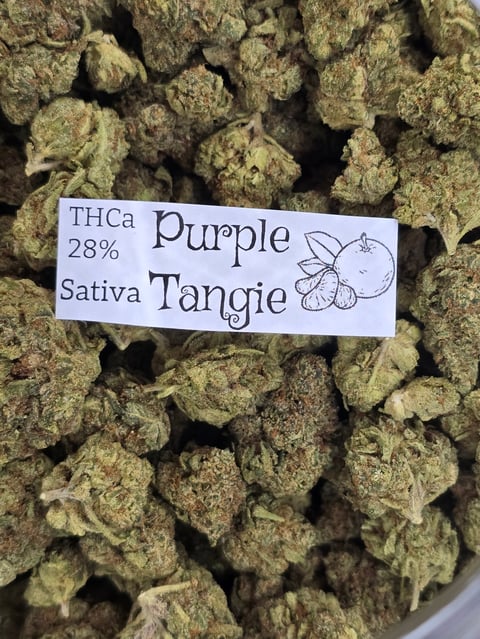 Cannabis buds labeled Purple Tangie, 28% THCa, Sativa strain with product identification tag