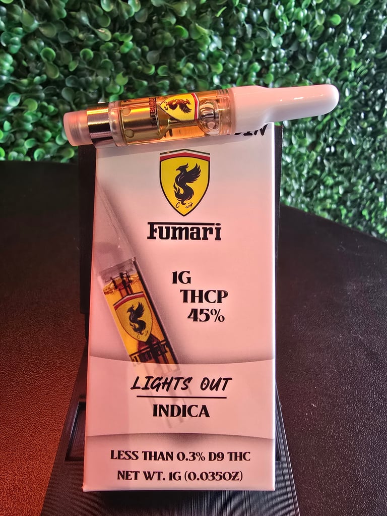 Fumari IG THCP vape cartridge 45% with packaging labeled Lights Out Indica strain on green textured background
