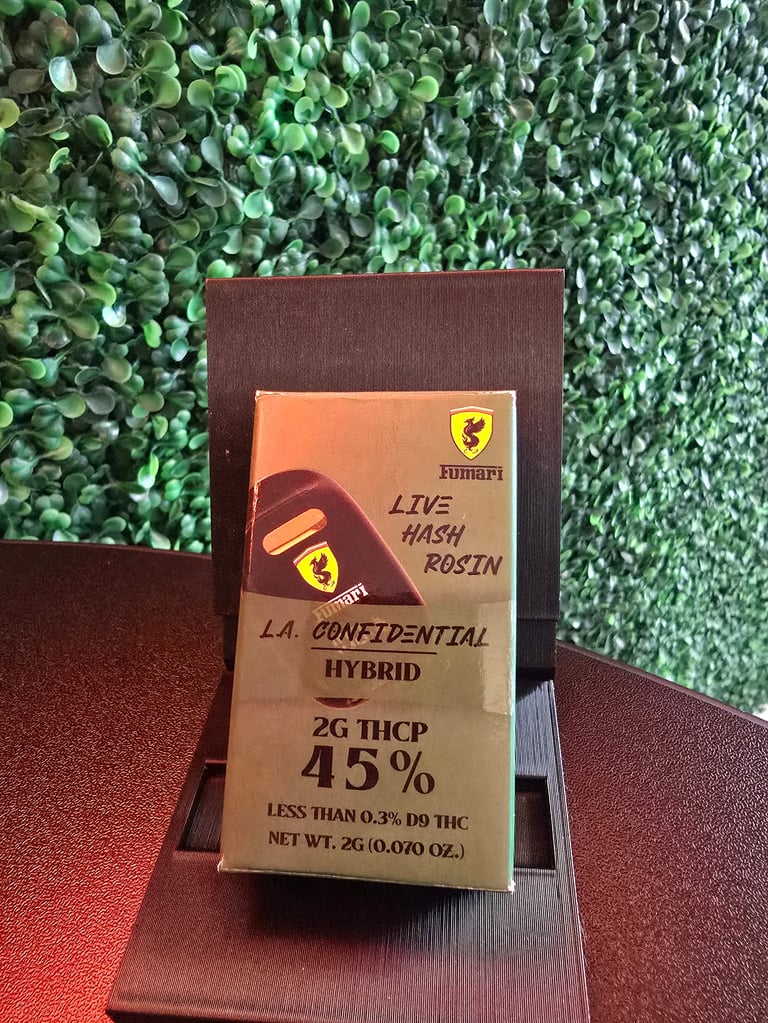 Cannabis product package for Runtz Live Hash Rosin hybrid with 45% THCP content, displayed on brown surface against green foliage backdrop