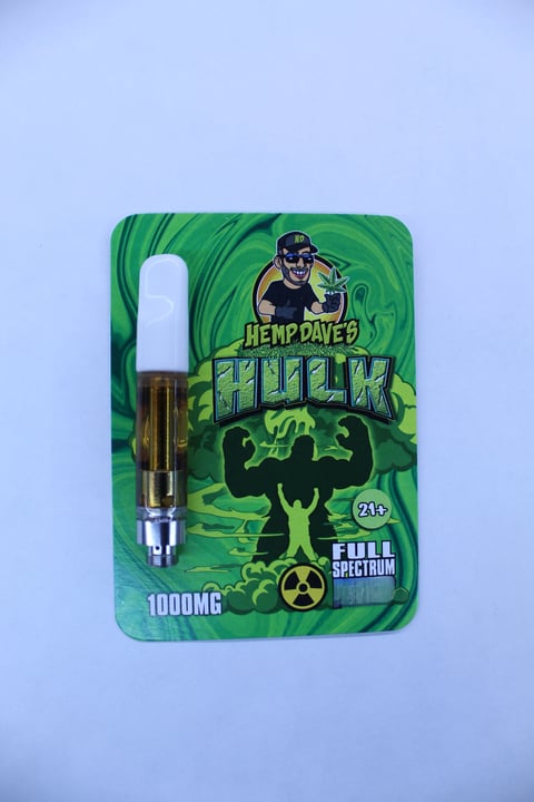 Hemp Daves Hulk vape cartridge packaging with 1000mg full spectrum CBD oil cartridge on light blue background