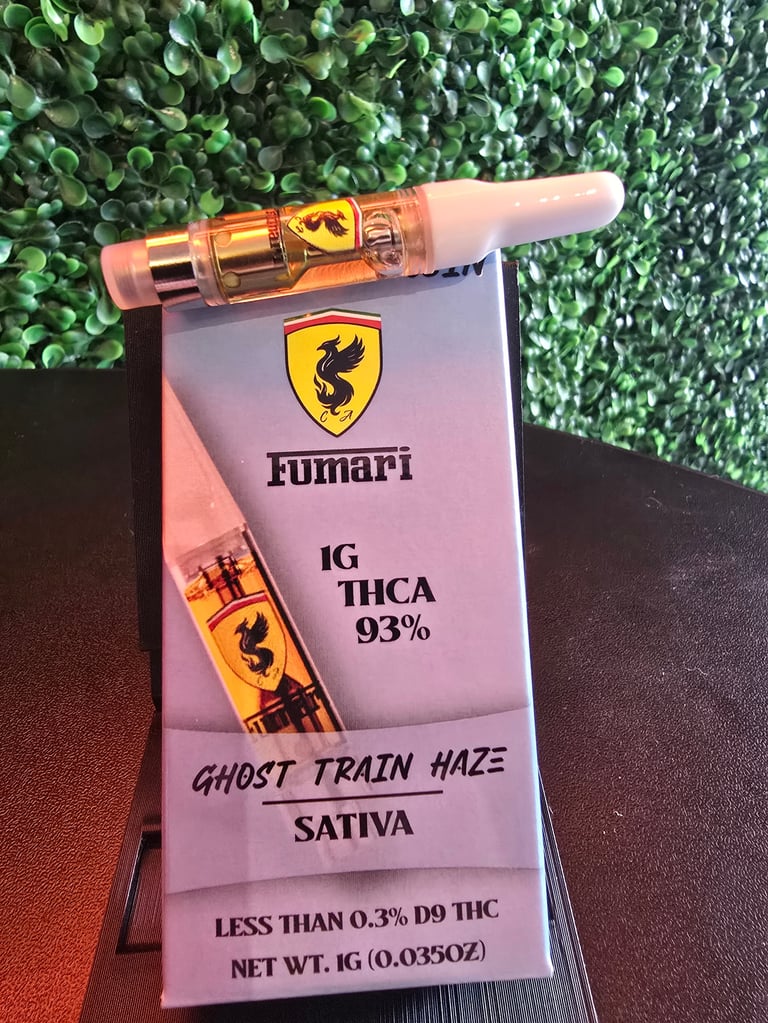 Fumari cannabis vape cartridge labeled Ghost Train Haze with 1g THCA 93%, displayed on pink packaging with green foliage background