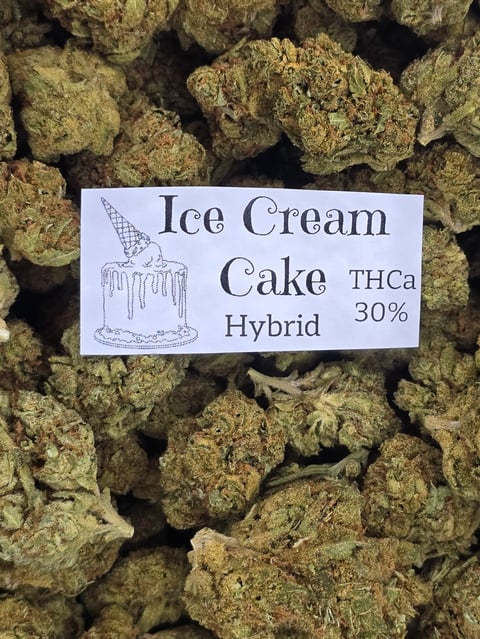 Cannabis flower buds labeled Ice Cream Cake Hybrid THCa 30% with ice cream cone illustration on white label