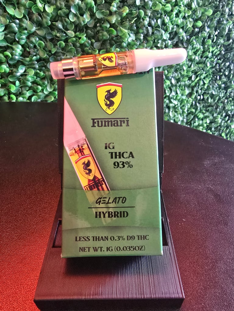 Fumari cannabis vape cartridge with box showing 1g THCA 93% hybrid product on green leaf background