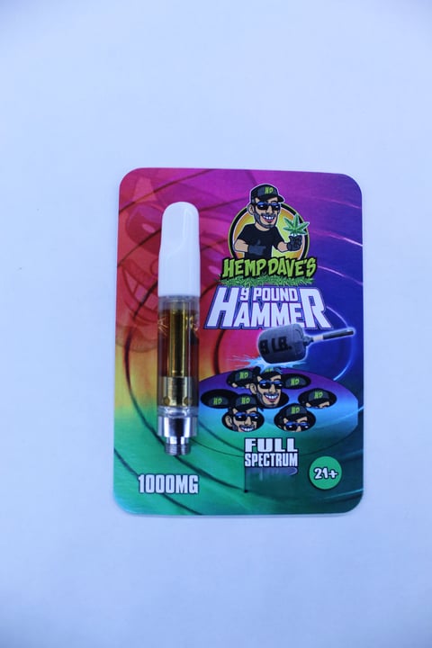 Hemp Daves 9 Pound Hammer vape cartridge packaging, 1000mg full spectrum, displayed on light blue background