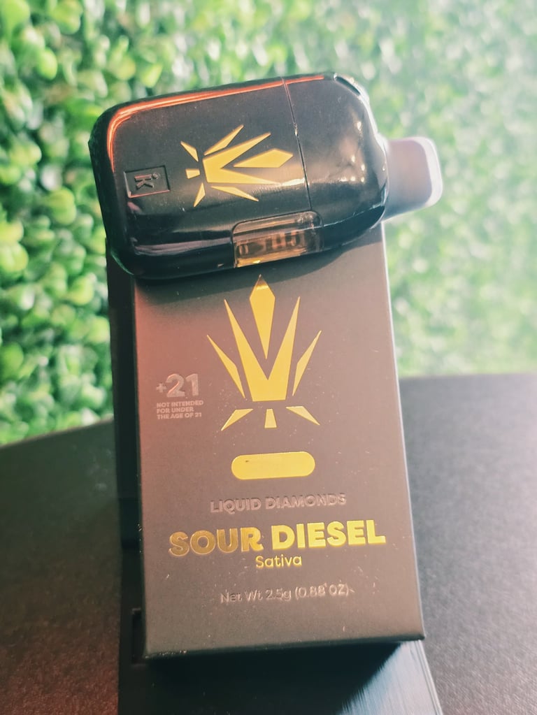 Liquid Diamonds Sour Diesel Sativa cannabis product box with black cap and gold crown logo design